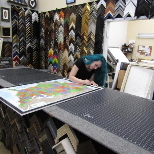 A Staff Member Doing a Custom Picture Framing Project at Jerry's Artarama of Raleigh, NC