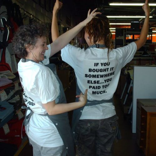 Two Staff Members of Jerry's Artarama Art Supply Store in Tempe, AZ Show Off Their Custom T-Shirts