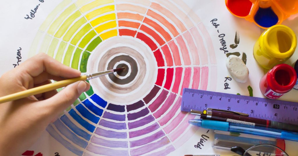 handmade color wheel with drawing and art supplies